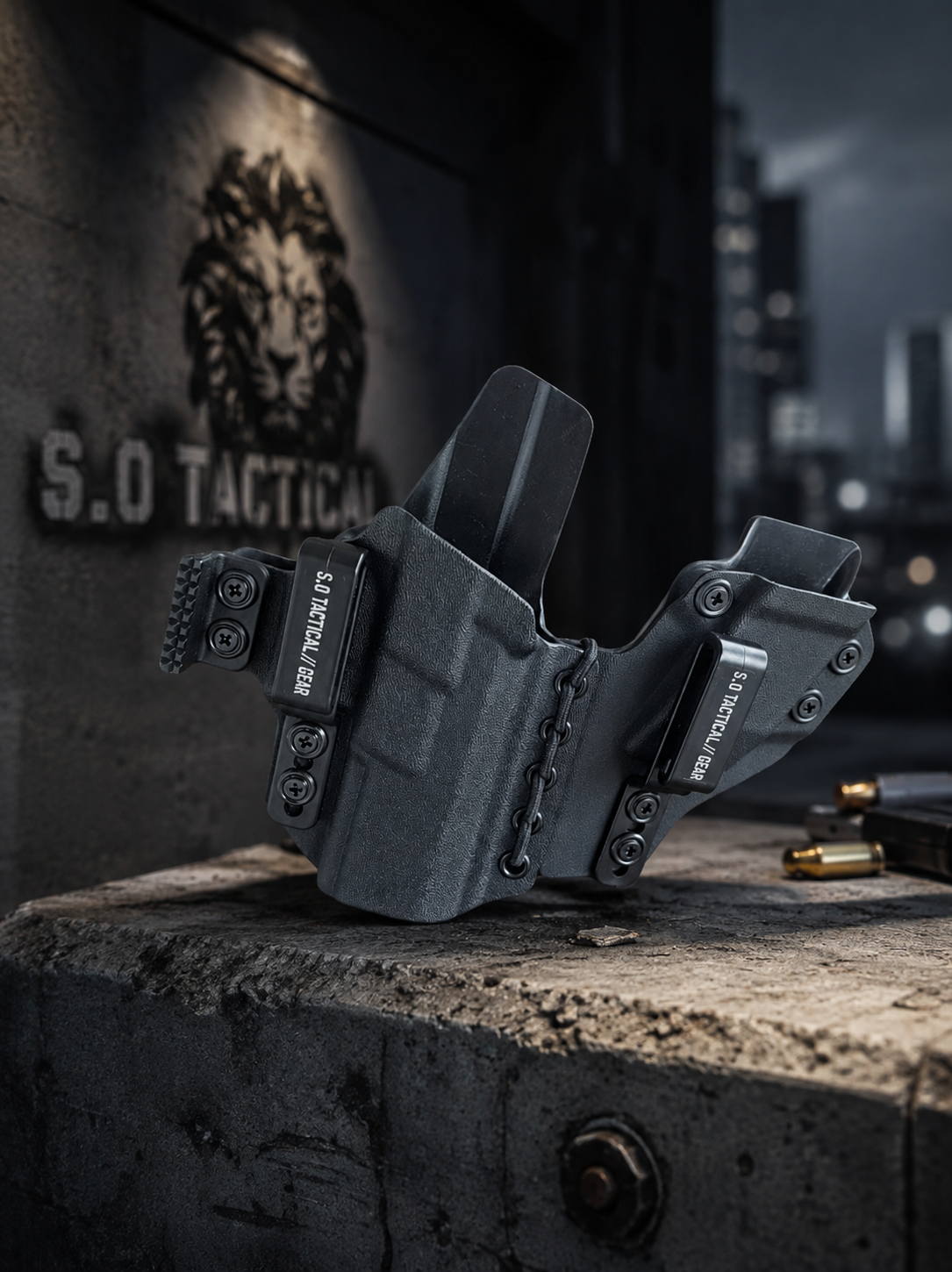 A dark gray S.O Tactical Kydex holster with an integrated mag pouch, displayed on a concrete ledge with a blurred city background and the S.O lion logo